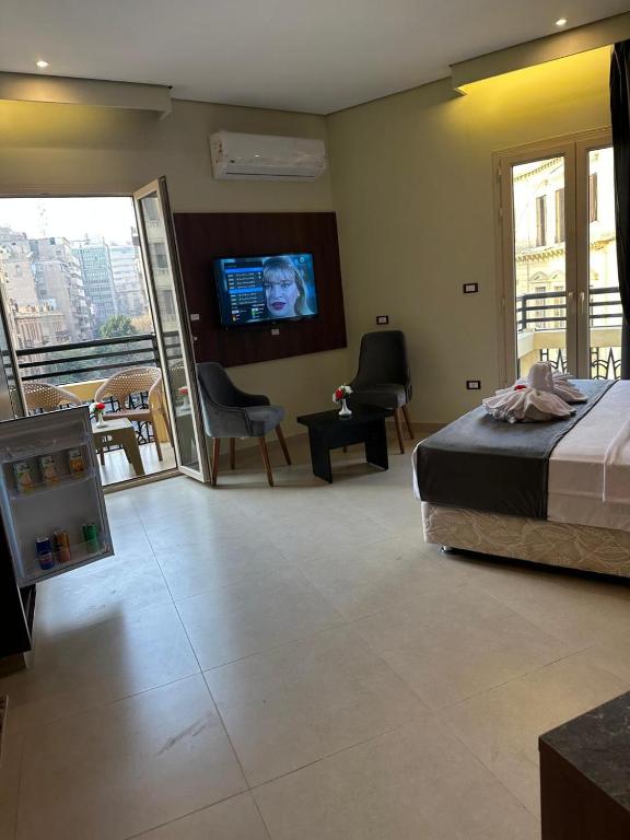 Postel nebo postele na pokoji v ubytování Sama hotel