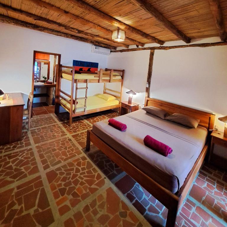 Postel nebo postele na pokoji v ubytování Suites La Tortuga