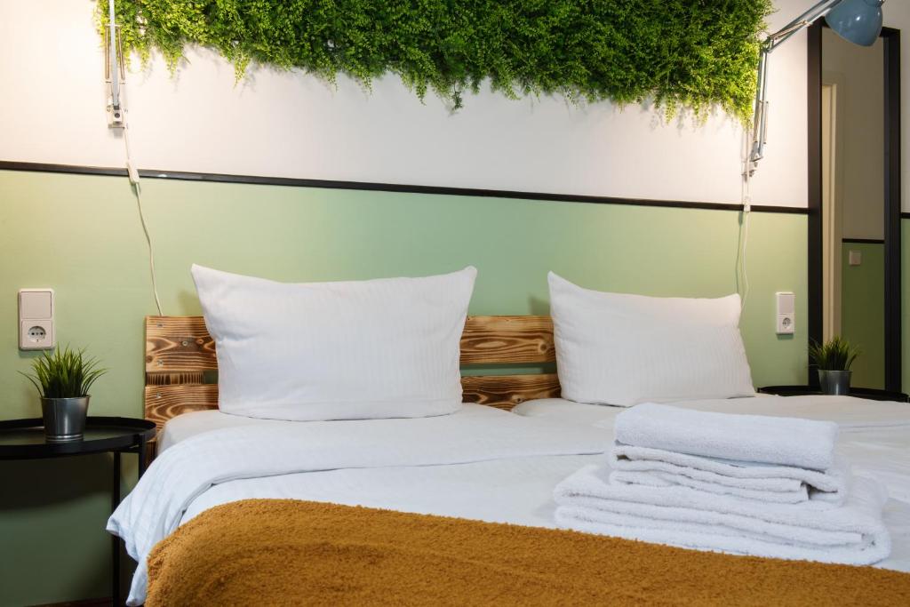 Postel nebo postele na pokoji v ubytování Hotel Alex Berlin