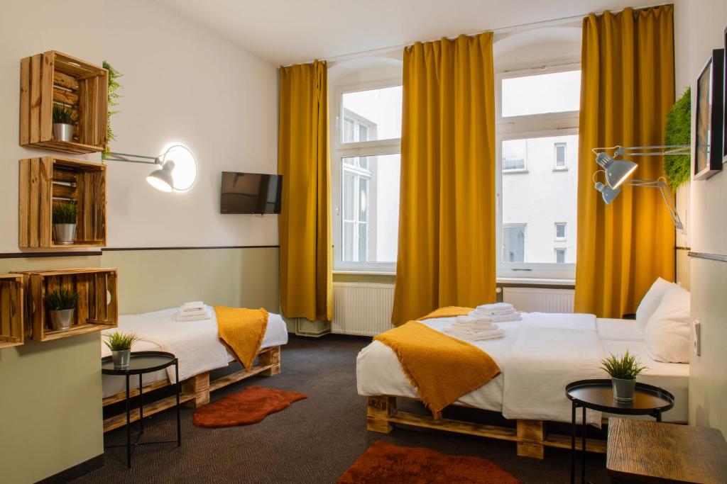 Postel nebo postele na pokoji v ubytování Hotel Alex Berlin