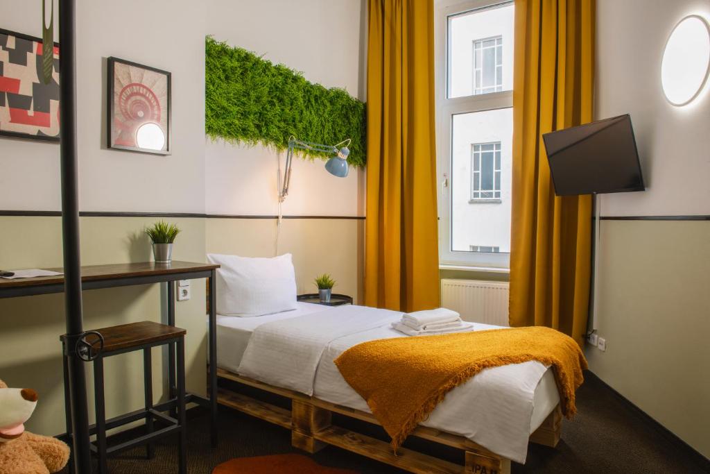 Postel nebo postele na pokoji v ubytování Hotel Alex Berlin
