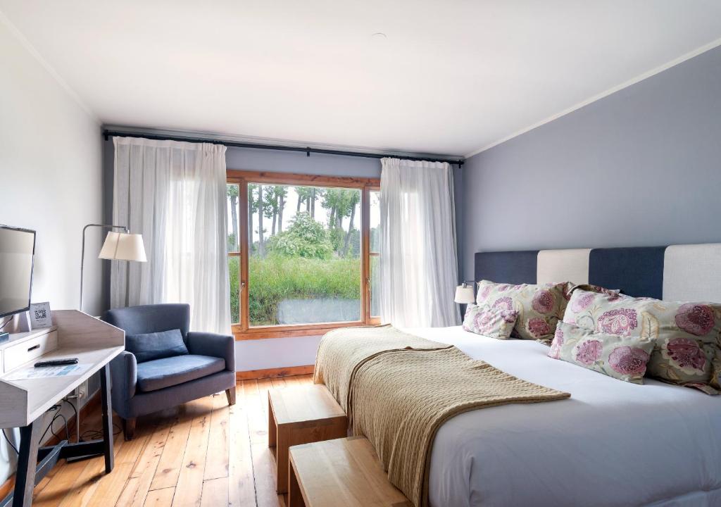 Postel nebo postele na pokoji v ubytování La Escondida Casa De Huespedes & Spa