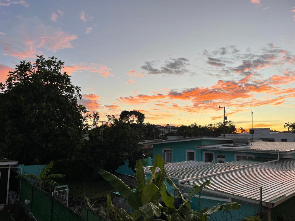 a sunset view from the roof of a house at The Monteray Hotel in Christ Church
