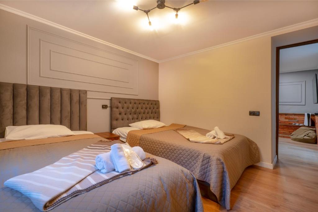 Postel nebo postele na pokoji v ubytování 4Season Villa