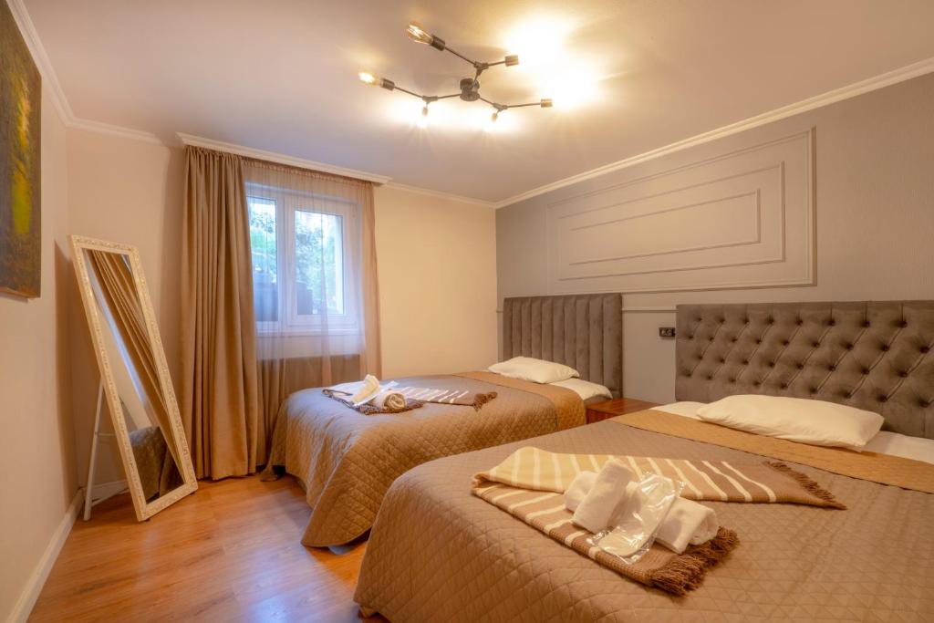 Postel nebo postele na pokoji v ubytování 4Season Villa