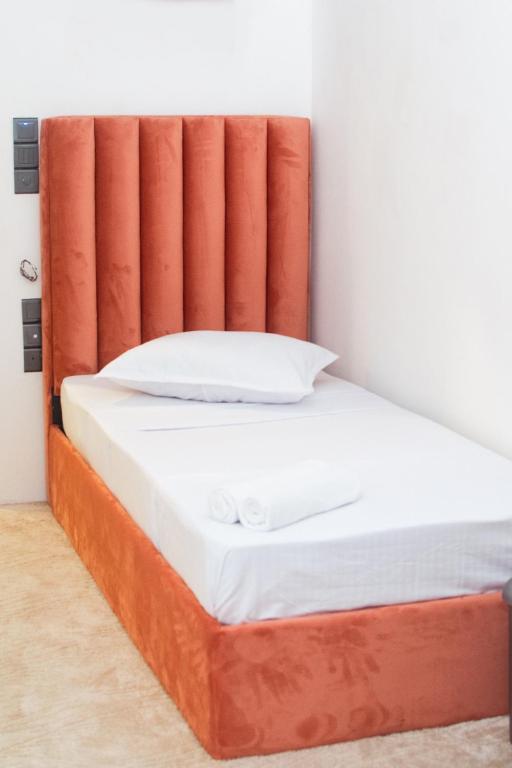 Postel nebo postele na pokoji v ubytování Kings Grand Hotel