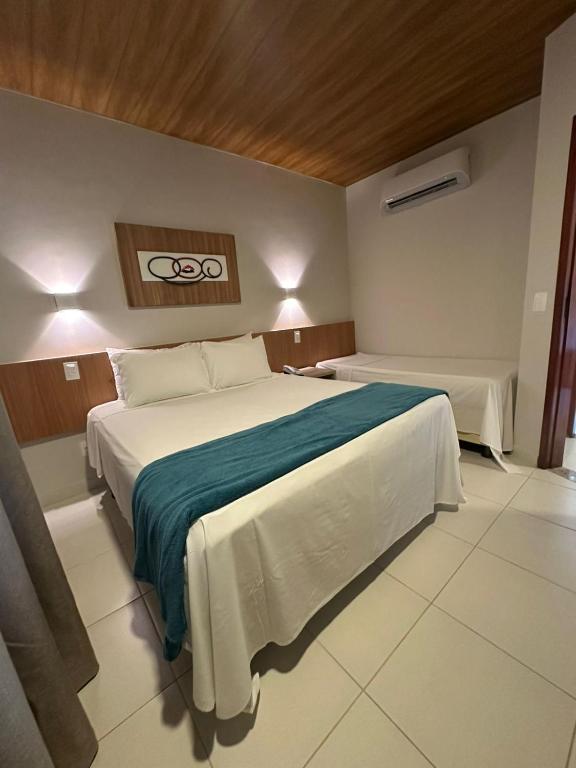 Postel nebo postele na pokoji v ubytování Ilheus North Hotel