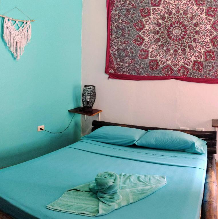 Postel nebo postele na pokoji v ubytování Cool Vibes Beach Hostel