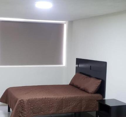 Postel nebo postele na pokoji v ubytování Hotel Estadía