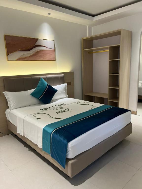 Postel nebo postele na pokoji v ubytování Aqua Heaven Inn