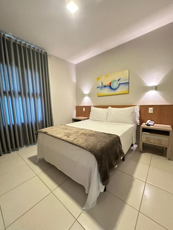 Postel nebo postele na pokoji v ubytování Ilheus North Hotel