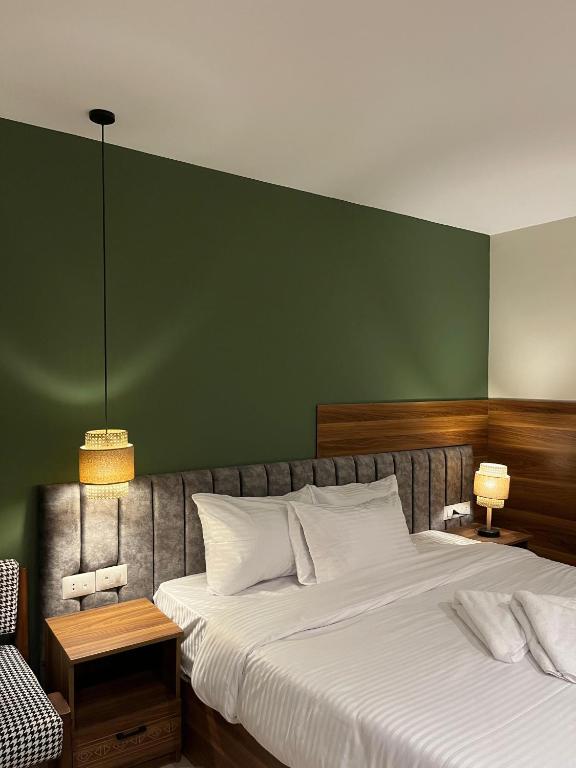 Postel nebo postele na pokoji v ubytování The Nomad Pyramids Boutique Hotel