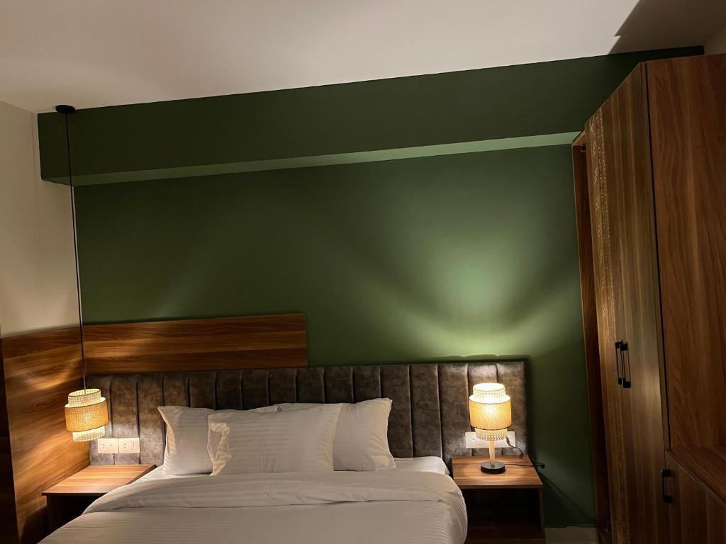 Postel nebo postele na pokoji v ubytování The Nomad Pyramids Boutique Hotel