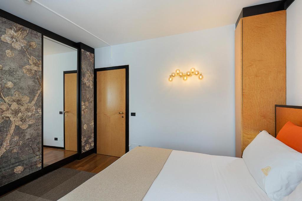Postel nebo postele na pokoji v ubytování Casa alle Colonne by Hotel Ancora