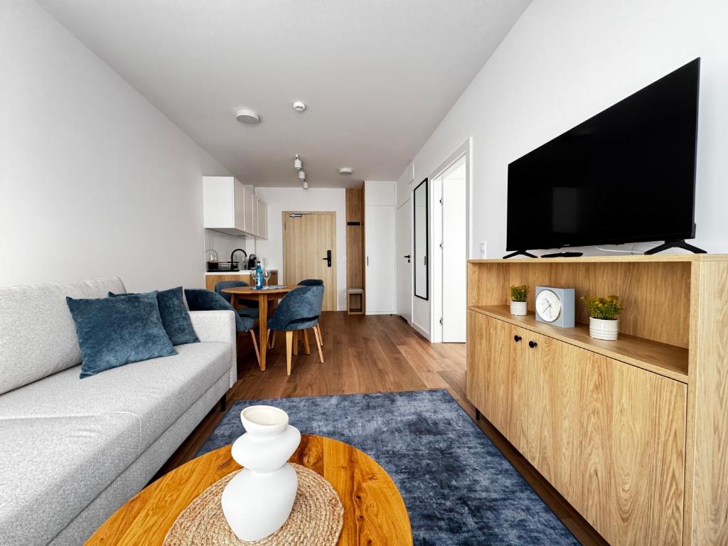 TV a/nebo společenská místnost v ubytování Aparthotel Anchoria Holiday Honest-Serwis