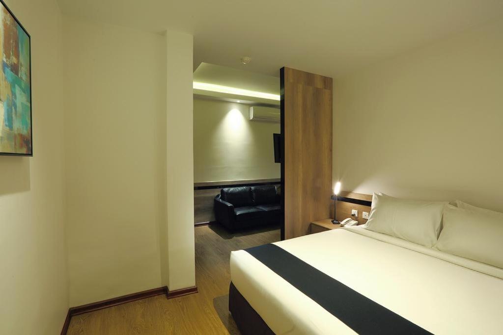 Letto o letti in una camera di K.C Hotel