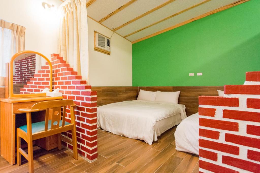 Postel nebo postele na pokoji v ubytování Donglifang B&B