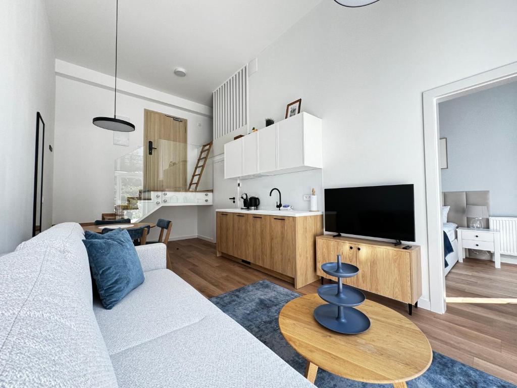 TV a/nebo společenská místnost v ubytování Aparthotel Anchoria Holiday Honest-Serwis