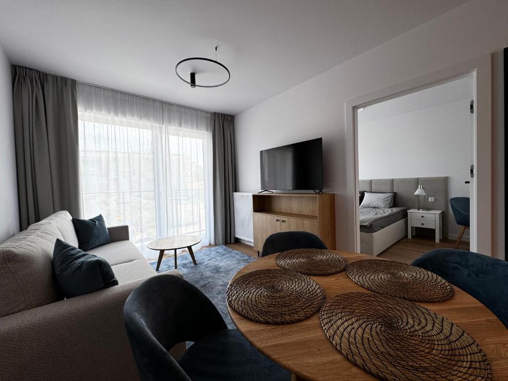 TV a/nebo společenská místnost v ubytování Aparthotel Anchoria Holiday Honest-Serwis