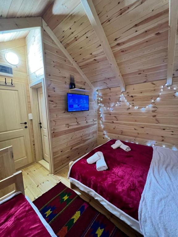 Postel nebo postele na pokoji v ubytování Vojinov kutak
