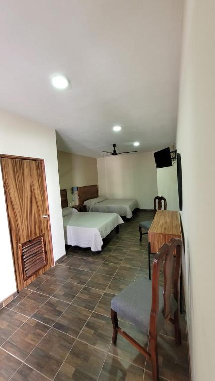 Postel nebo postele na pokoji v ubytování Hotel Amecatl