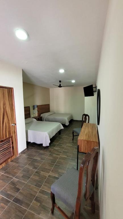 Postel nebo postele na pokoji v ubytování Hotel Amecatl
