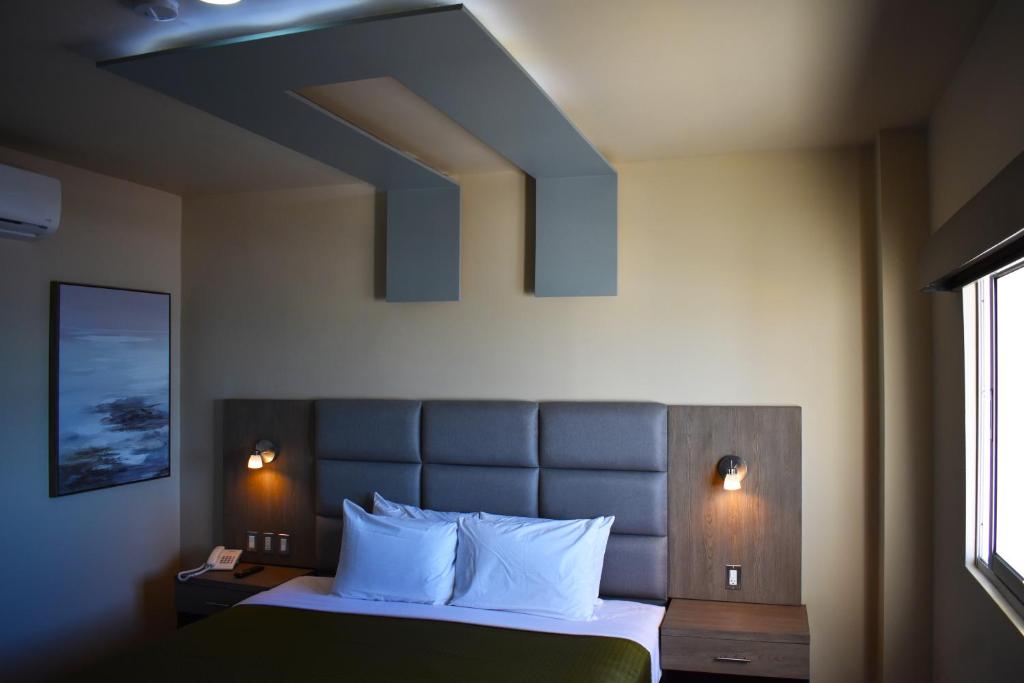Postel nebo postele na pokoji v ubytování Hotel Jatay