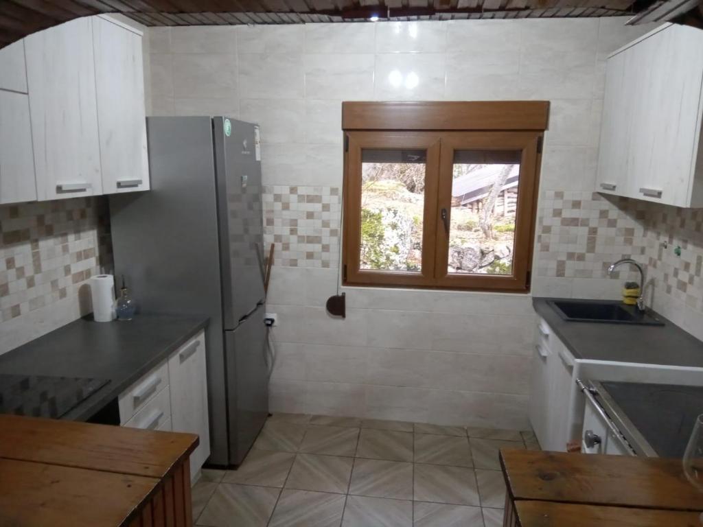 Kuchyň nebo kuchyňský kout v ubytování House under peaks