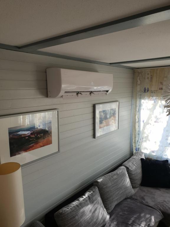 a living room with a couch and a window at Ferienhaus 52 in Kirchheim