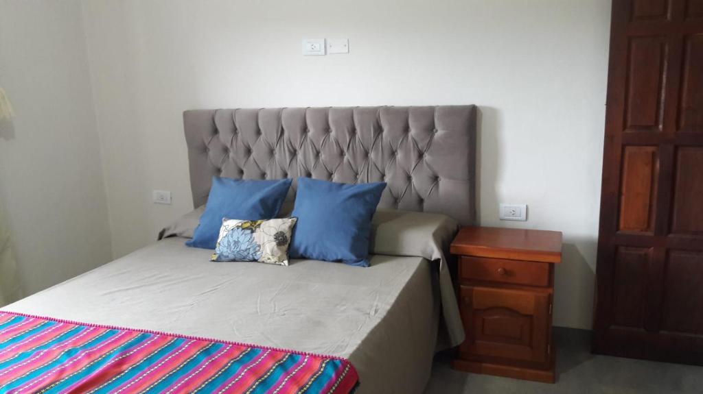 Postel nebo postele na pokoji v ubytování Cabañas Tafi