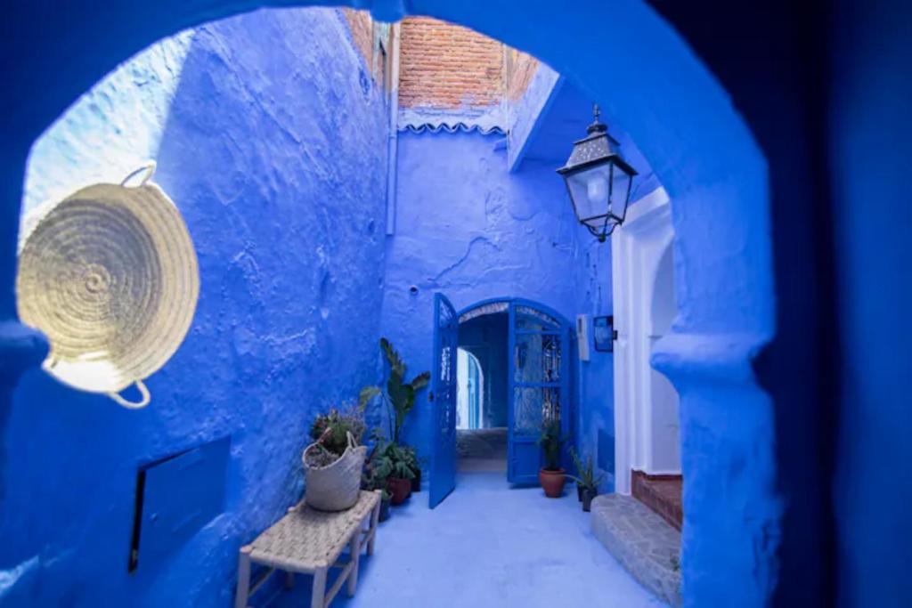 Una cama o camas en una habitación de Dar YAMINA SUIKA