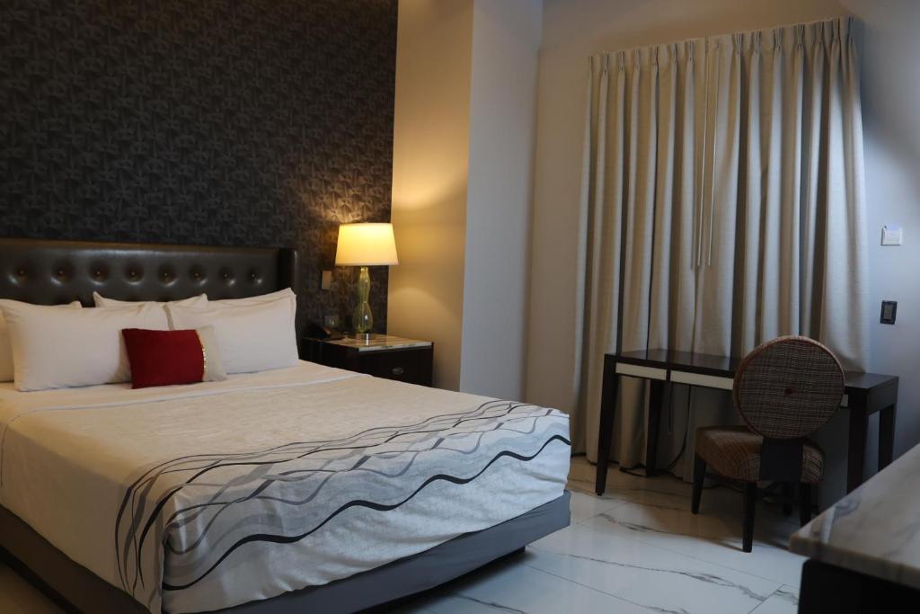 Postel nebo postele na pokoji v ubytování Hotel Wellintown