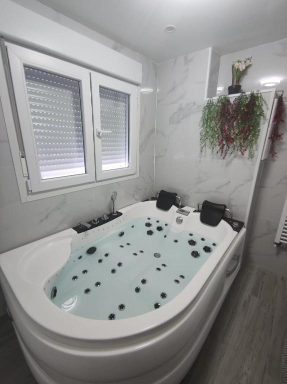 Apartamento con Jacuzzi: El Rincón de las Delicias - Jacuzzi privado en la habitación en Zaragoza