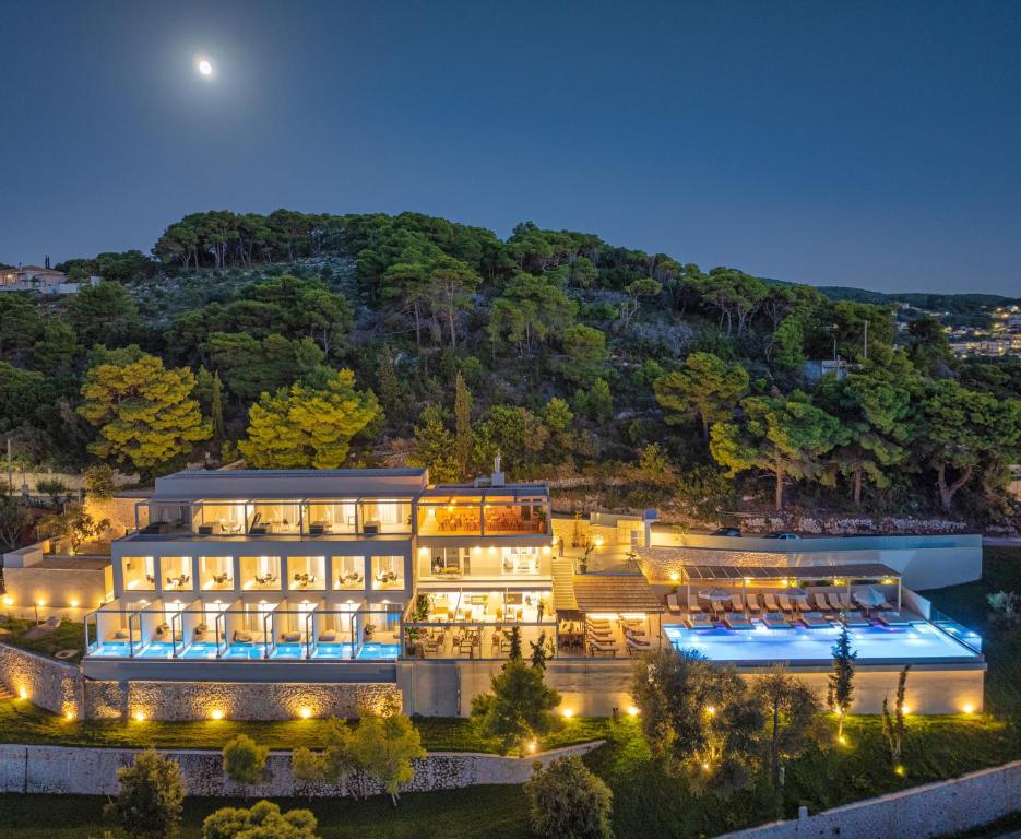 an aerial view of a hotel at night at Myzith Luxury Suites in Keri