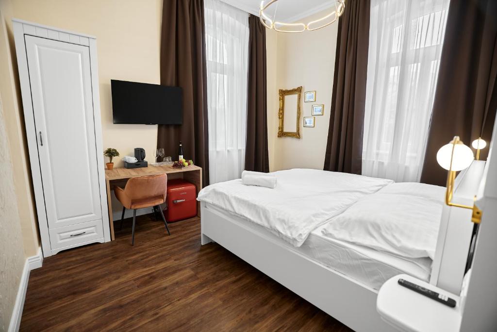 Postel nebo postele na pokoji v ubytování Chateau Franz