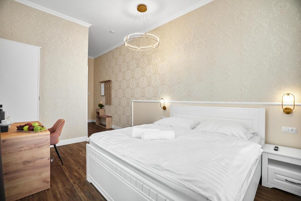 Postel nebo postele na pokoji v ubytování Chateau Franz