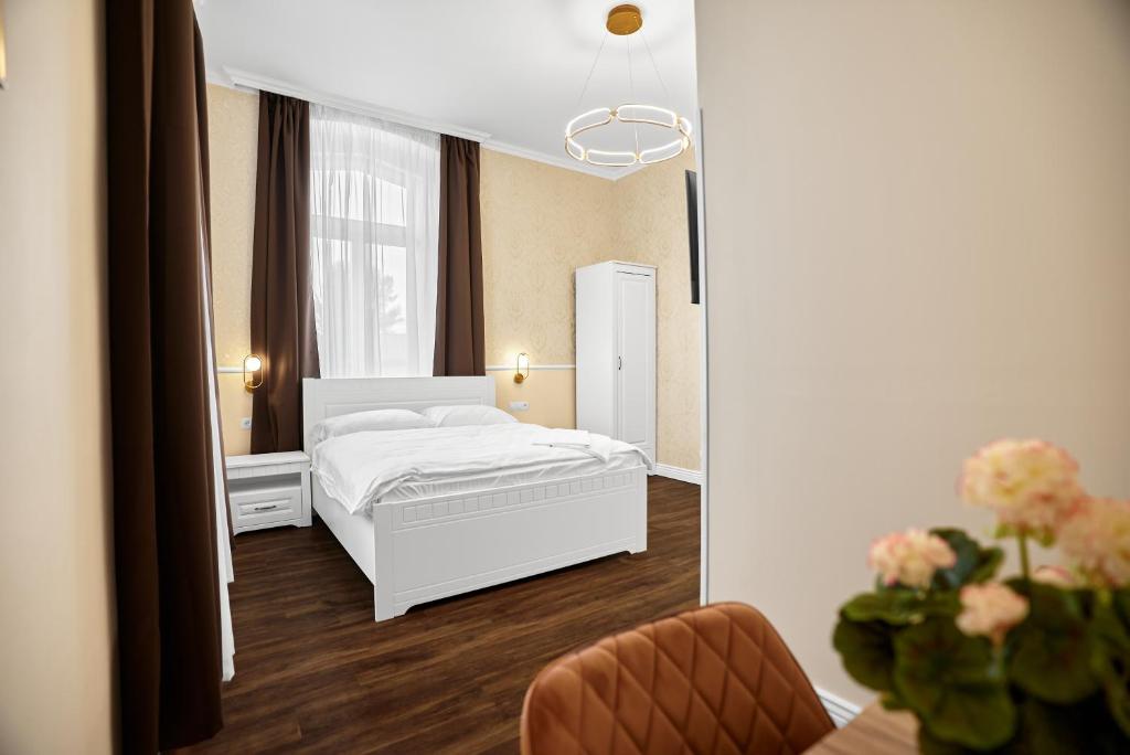 Postel nebo postele na pokoji v ubytování Chateau Franz