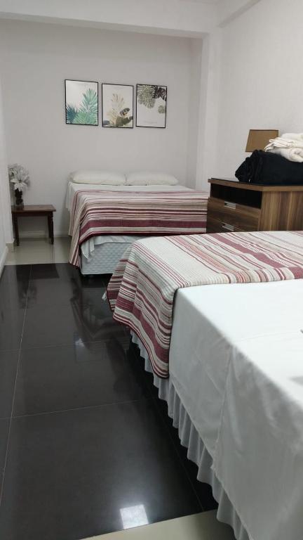 Postel nebo postele na pokoji v ubytování Stefanich Aparthotel 90