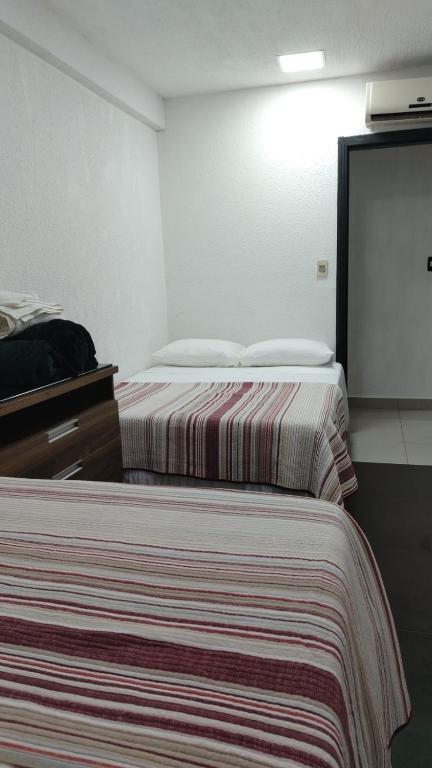 Postel nebo postele na pokoji v ubytování Stefanich Aparthotel 90
