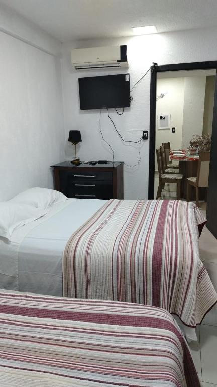 Postel nebo postele na pokoji v ubytování Stefanich Aparthotel 90