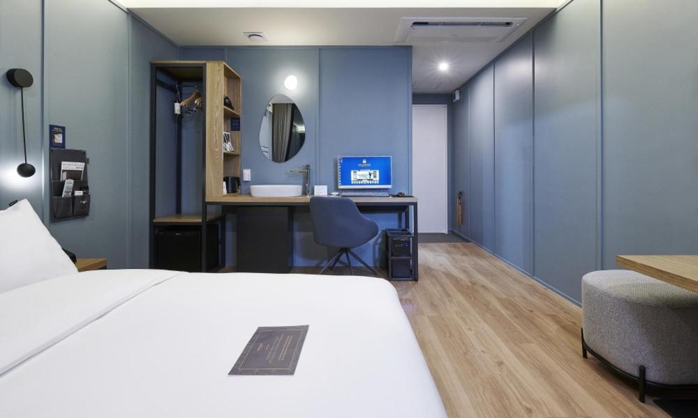 Postel nebo postele na pokoji v ubytování JustSleep Namyangju Dasan