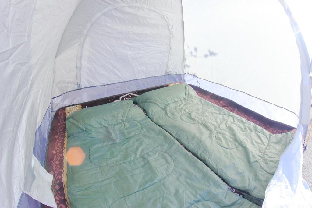 Postel nebo postele na pokoji v ubytování Ataata Resort