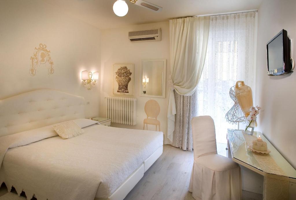 Posteľ alebo postele v izbe v ubytovaní Hotel Serenella