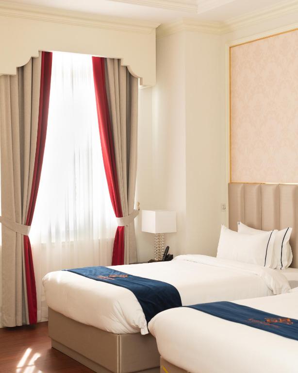 Postel nebo postele na pokoji v ubytování THE PREMIER PALACE HOTEL AND SPA