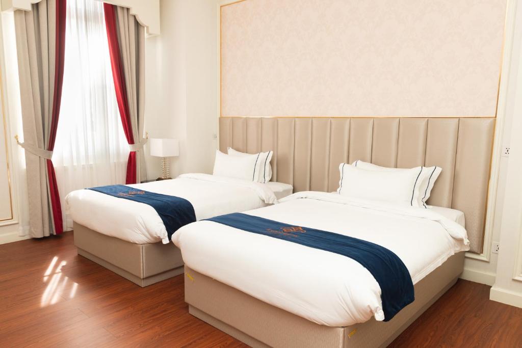 Postel nebo postele na pokoji v ubytování THE PREMIER PALACE HOTEL AND SPA