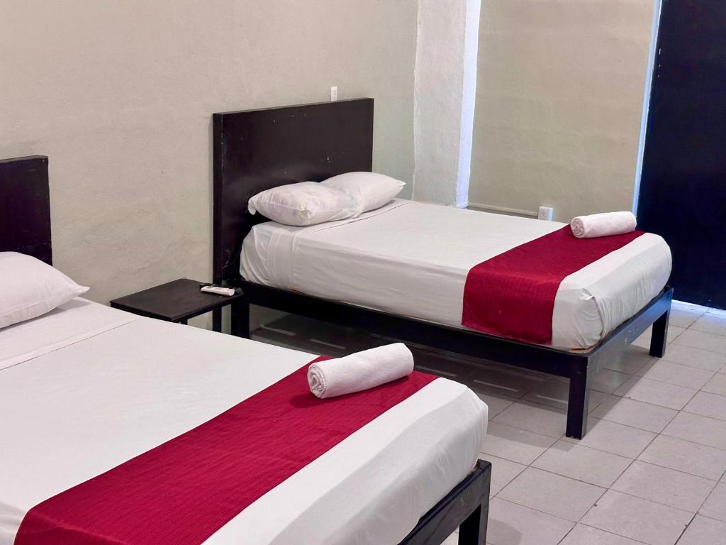 Postel nebo postele na pokoji v ubytování Casa Vidal Hotel