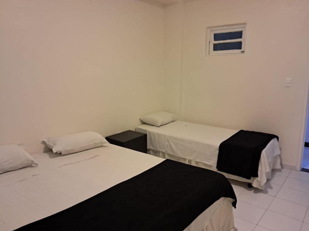 Pousada Recife Tropicalにあるベッド