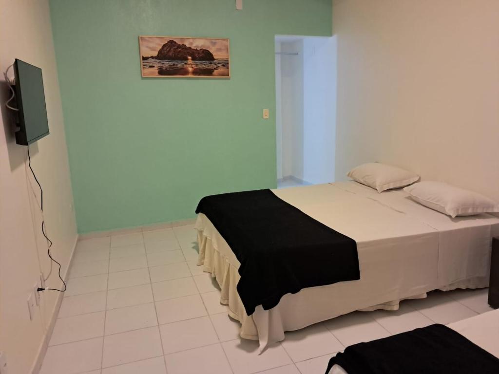 Pousada Recife Tropicalにあるベッド