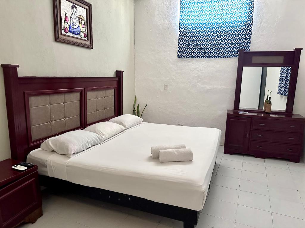 Postel nebo postele na pokoji v ubytování Casa Vidal Hotel