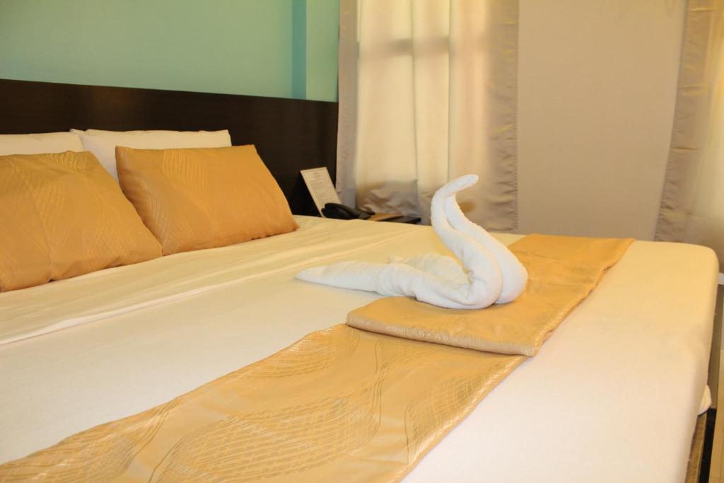 Postel nebo postele na pokoji v ubytování Coron Visitors Hotel